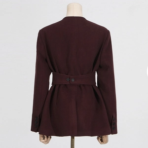 Rear view of wine red waist-defining blazer with decorative buttons and pleated hemline
