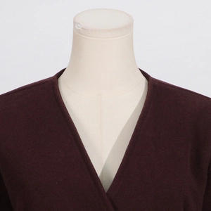 Detail view of the V-neck design and premium burgundy fabric on the long sleeve top