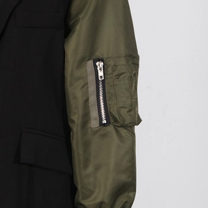 Detail of bomber jacket sleeve with nylon fabric and functional zipper utility pocket
