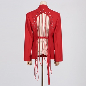 Close-up of red blazer back featuring a crystal-rhinestone circle and long fringe details