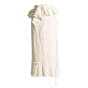 Detailed view of the layered ruffle waist and natural cotton linen texture on white skirt
