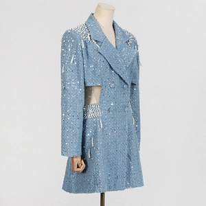Detail of light blue sequined dress featuring pearl bead fringe and waist cut-out design