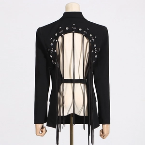 Detail of the back cutout on a black blazer with rhinestone trim and long tassels