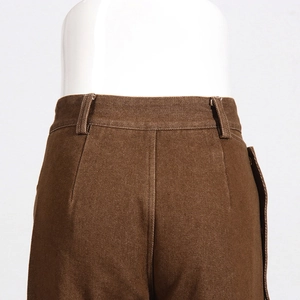Detail shot of brown trousers showing waistline belt loops and precise stitching texture