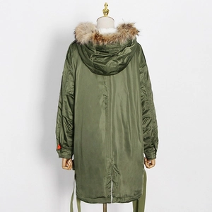 Detail view of the army green parka back featuring a luxury fur trim and drawstring hem