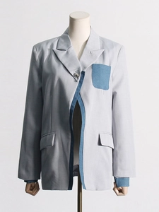 Women's light grey suit jacket with creative blue denim patchwork and silver button detail