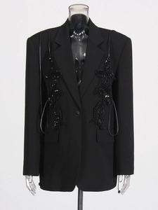 Women's black single-breasted blazer featuring elegant 3D floral patches and sequins