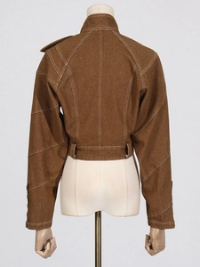 Brown cropped jacket with white contrast stitching and geometric deconstructed design