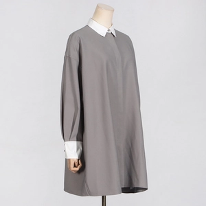 Detail of grey A-line shirt dress with contrasting white collar and cuffs for a sleek look