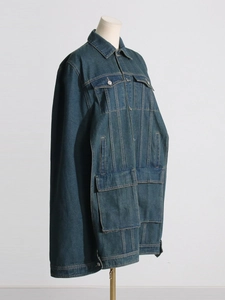 Women's deep blue denim work jacket with multi-pocket design and retro workwear style