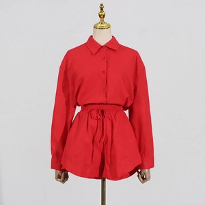Detail view of red long sleeve lapel shirt and drawstring shorts two-piece set