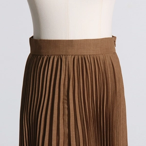 Detailed view of dark brown pleated midi skirt with side invisible zipper and fine texture