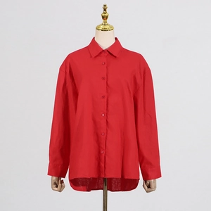 Detail of burgundy long sleeve shirt showing classic lapel collar and linen texture fabric