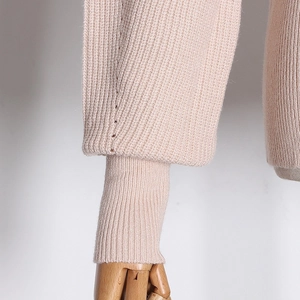 Close-up of elegant ribbed cuffs on a soft knit sweater with refined stitching details
