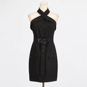 Detail of cross-halter neckline and waist belt on a black utility-style mini dress
