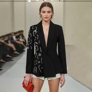 Detail of luxury black blazer with handmade colorful gemstone and pearl embroidery