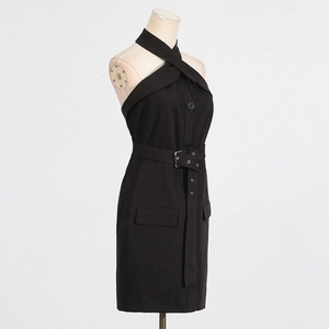 Detail of elegant black halter neck dress with waist belt and button accents