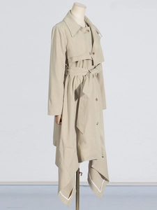 Chic beige long trench coat with asymmetrical hem and belted waist for women