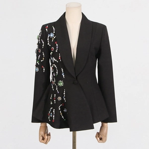 Detail of colorful rhinestones and pearls embroidery on black blazer with wavy hem