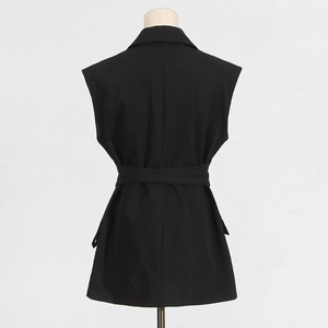 Back view of a black sleeveless blazer vest with a lapel collar and waist belt