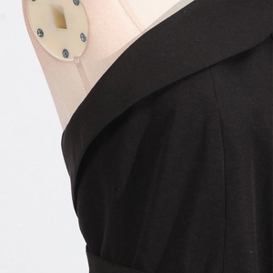 Detail of elegant black halter neck and tailored lapel on sleeveless summer dress