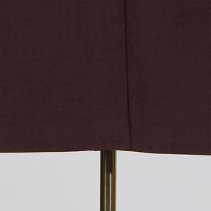 Detailed close-up of side slit design and reinforced stitching on high-end dark brown blazer