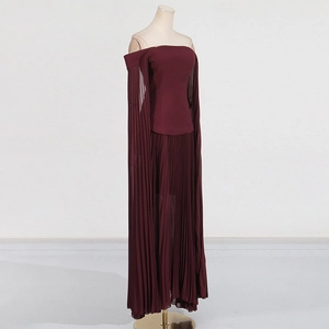 Detail of burgundy off-shoulder pleated maxi dress featuring fine fabric texture