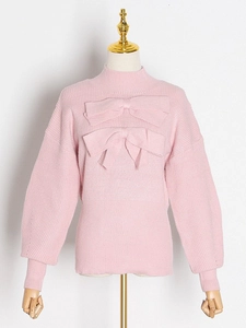 Pink knit sweater with stylish bow accents and ribbed trims for a feminine casual look