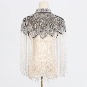 Detail of silver heavy bead embroidery and long fringes on a vintage shawl jacket