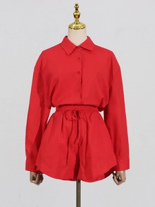 Women's chic red two-piece set featuring a long sleeve lapel shirt and high-waisted shorts