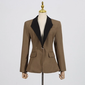 Detailed view of women's coffee blazer featuring a black peak lapel and metal ring buckle