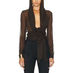 Detail of sheer brown hooded wrap blouse showing semi-transparent fabric and waist ties
