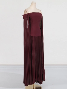 Elegant burgundy off-the-shoulder gown with pleated cape sleeves and long flowing skirt
