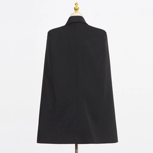 Back view of stylish black cape blazer showing structured A-line fit on mannequin