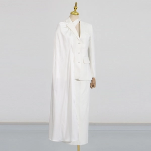 Detail of white blazer with pearl buttons and elegant long asymmetric silk drape