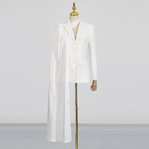 Detail of white tailored blazer with pearl buttons and elegant draped shawl sleeve
