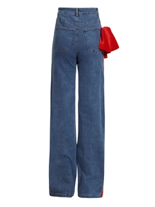 High-waisted wide-leg denim jeans featuring a bold red satin bow and side stripe detail