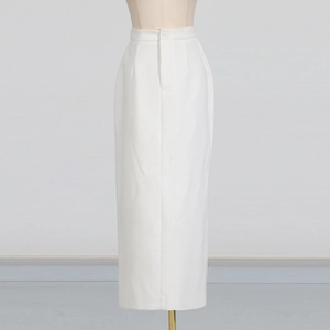 Detailed view of white high-waist straight maxi skirt with button and zipper closure