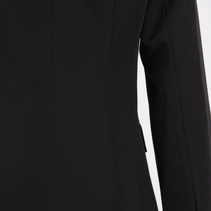 Detailed close-up showing the precise stitching and premium matte fabric of black suit