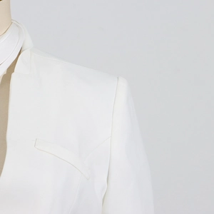 Detail of white blazer shoulder and notch lapel on a professional garment mannequin