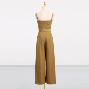 Detail view of khaki jumpsuit featuring slender straps and back invisible zipper design