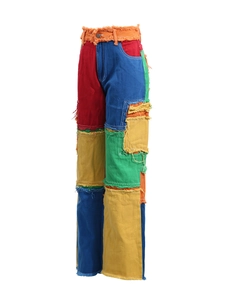 High-waisted distressed straight jeans with colorful patchwork and frayed edge details