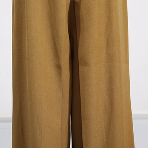 Detail of premium textured fabric and draping on summer sleeveless jumpsuit