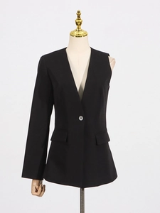 Women's black asymmetric blazer set with one long sleeve and high waist trousers