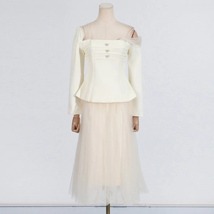 Detail of square neck mesh top with rhinestone buttons and high waist midi skirt set
