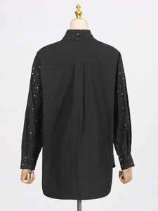Women's black long sleeve shirt with rhinestone embellishments on collar and sleeves