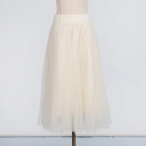 Detailed view of light beige mesh midi skirt with multi-layer puffy tulle design