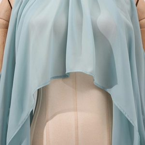 Detail of light blue chiffon fabric showing sheer texture and elegant drape on mannequin