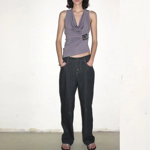 Detail of grey-purple sleeveless tank top with draped neck and pleated waist with sequins