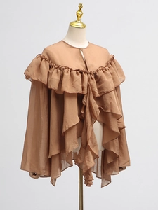 Brown ruffle mesh blouse with tiered layers and long sleeves on a white mannequin